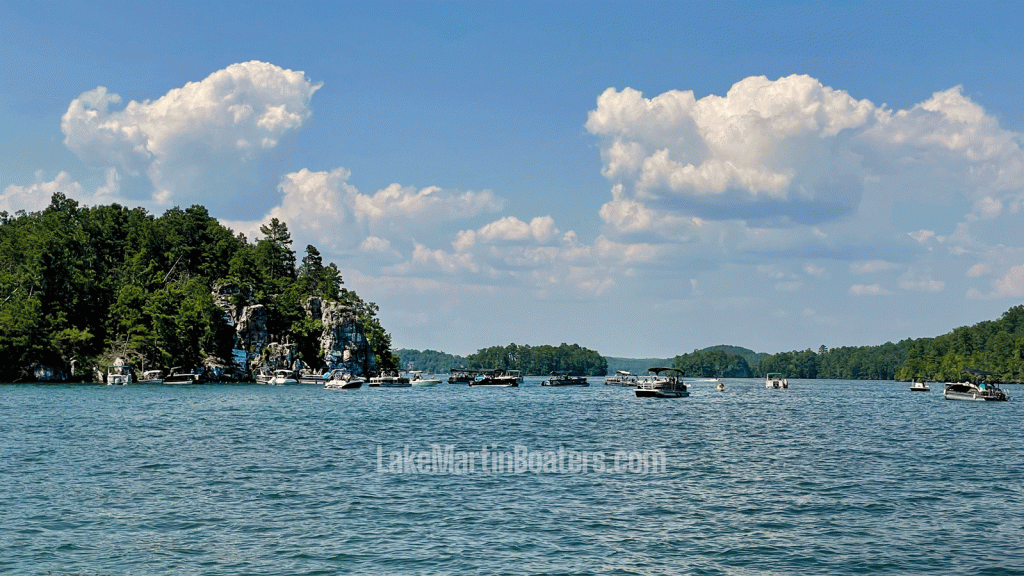 Chimney Rock on Lake Martin Alabama with boats anchored nearby